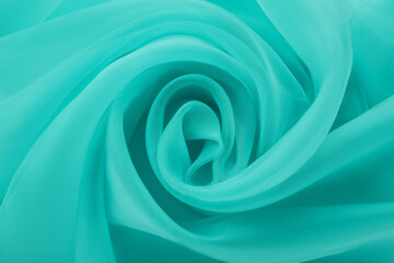 Beautiful turquoise color tulle, closeup view of fabric