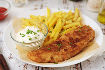 Fish and chips served on the plate, traditional dish of Great Britain