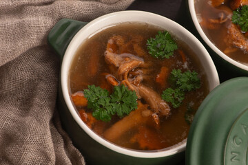 Soup with chanterelle mushrooms close up