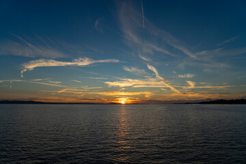sunset over lake constance ( Bodensee )  with blue sky and clouds but clear sight in lindau, germany