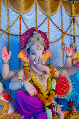 Fototapeta premium A Closeup shot Ganpati Installed in a Pandal during the 10 Day Ganesh Festival, the idols are immersed in heavy water bodies after the 10 days.