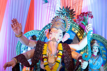 A Closeup shot Ganpati Installed in a Pandal during the 10 Day Ganesh Festival, the idols are immersed in heavy water bodies after the 10 days.