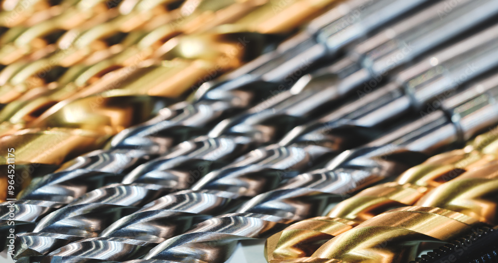 Poster a row of drills with different colors and sizes. the drills are arranged in a way that they are all 