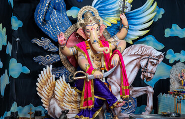 A Closeup shot Ganpati Installed in a Pandal during the 10 Day Ganesh Festival, the idols are immersed in heavy water bodies after the 10 days.