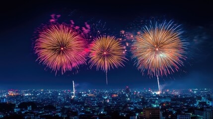 Fototapeta premium Fireworks lighting up the night sky over a cityscape, symbolizing joyful and patriotic Independence Day celebrations.