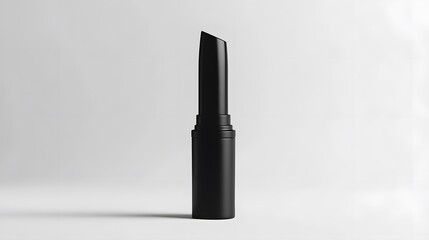 Obraz premium Matte Lipstick Tube: A matte black lipstick tube standing upright on a white background, with minimal reflections and clean lines. 