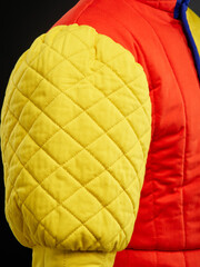 Historical fashion. Medieval knight cloth. Padded jacket gambeson.