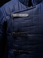 Historical fashion. Medieval knight cloth. Padded jacket gambeson.