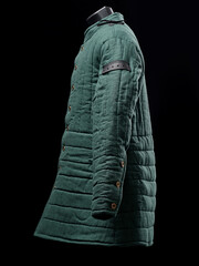 Historical fashion. Medieval knight cloth. Padded jacket gambeson.
