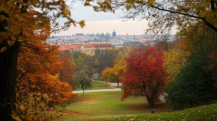 Obraz premium Prague's Letn Park during autumn, with colorful foliage framing views of the city.