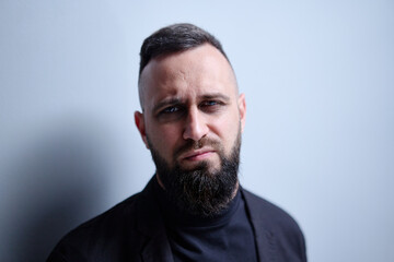 Fototapeta premium Studio portrait of young handsome man with beard.