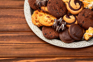 Mix of cookies . Many unhealthy snacks . Top view