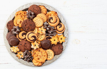 Mix of cookies . Many unhealthy snacks . Top view