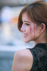 Close-up shot of a female model wearing a black Chinese cheongsam.