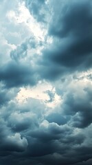 Obraz premium Dramatic overcast sky filled with dark clouds, casting an ominous mood over the landscape, perfect for weather-themed projects.