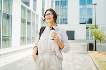 Young caucasian women student going to university at university campus	