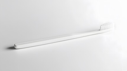 Simple Toothbrush: A plain, white toothbrush with a minimalist design, lying flat on a white background, with a soft shadow beneath it.
