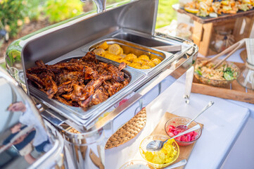 grilled ribs with corn and dip in heating steel box