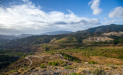 Fototapeta premium Panoramic view of the Sierra de Cieza, Region of Murcia, Spain, with golden sunrise light