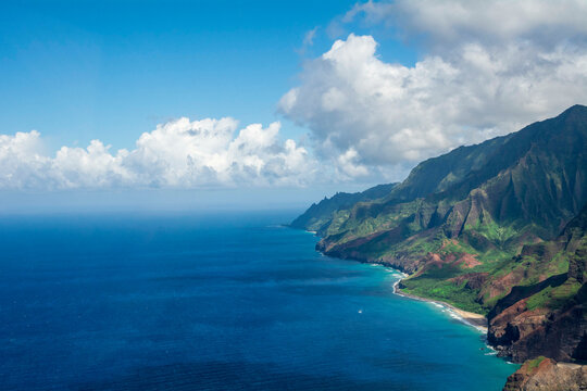 Na Pali valley, beach and mountains on coast by ocean in Kauai, Hawaii