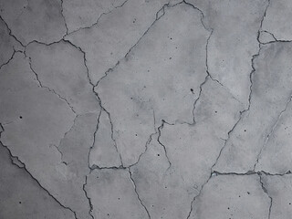 Obraz premium Cracks in the concrete stone block, construction industry concept, grunge rough texture