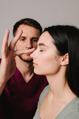 Rhinoplasty to improve appearance of nose. Woman is going through rhinoplasty nose surgery to constantly remove dorsal hump.