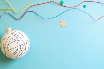 Minimalist Christmas Disco Ball Ornament with Colorful Lights and Stars on Pastel Blue Background, Retro 90s Holiday Vibe