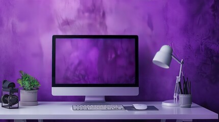 Modern workspace with computer, keyboard, mouse, lamp, and plant on a white desk with a purple wall behind.