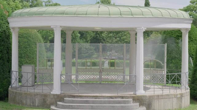Historical Gazebo Surrounded by Lush Greenery and Trees in Stadtpark, Vienna - Austria