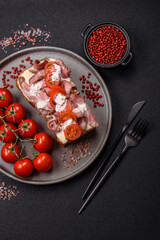 Sandwich with brioche bun, roast beef, tomatoes, stracciatello