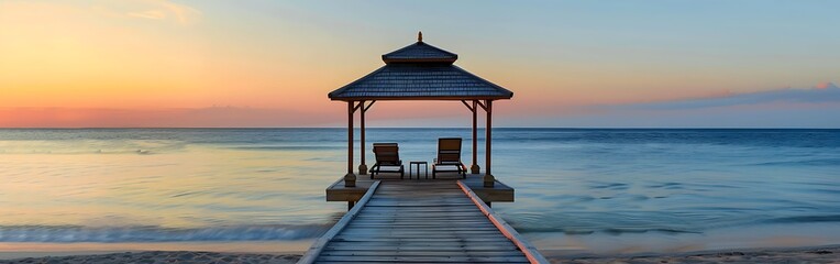Sunset Over Wooden Pier in the beach.