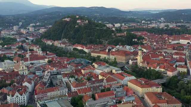 Graz Cityscape in Austria. Graz is the capital city of the southern Austrian province of Styria. At its heart is Hauptplatz, the medieval old town&rsquo;s main square. Beautiful Sunset Light. Drone, 4k.