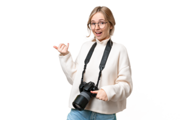 Young photographer English woman over isolated background making guitar gesture