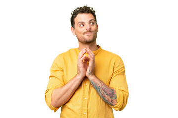 Brazilian man over isolated chroma key background scheming something
