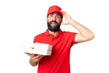 Pizza delivery man with work uniform picking up pizza boxes over isolated chroma key background with surprise expression