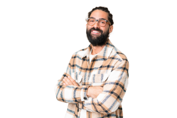 Young man with beard over isolated chroma key background with arms crossed and looking forward