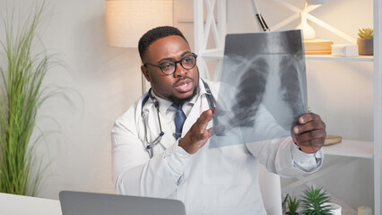 Radiology doctor. Clinical diagnosis. Professional healthcare. Serious man physician examining...