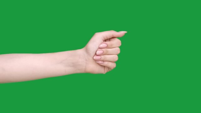 Vertical video. Goodbye gesture. Leaving bye. See you. Farewell sign. Female hand waving isolated on green chroma key empty space background.