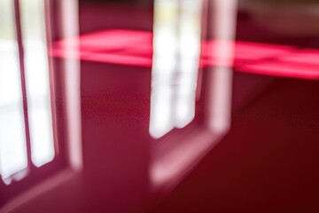 Blurred Reflections of Light on a Red Surface
