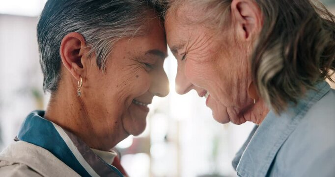 Happy, lesbian couple and forehead touch for love, support and romantic connection in home. Smile, gay and mature women in relationship for commitment, lgbtq and eyes closed for loyalty in marriage