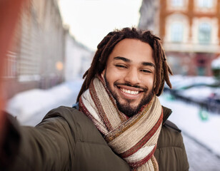 Winter Portrait of Happy Handsome Man Smiling Outdoors