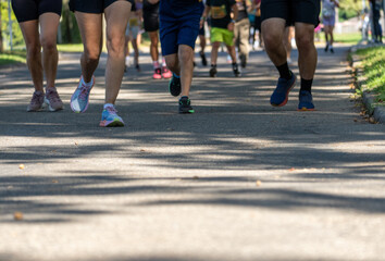 Feet of marathon runners. Runners on the street. Healthy lifestyle.