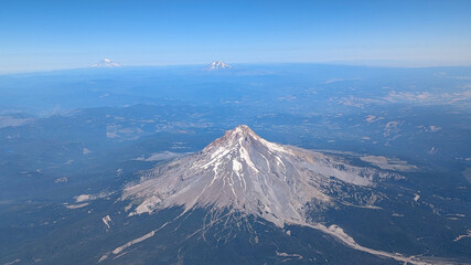 Aerial view wide angle of Mt Hood, Mt Adams and Mt Rainier, Cascade Mountain range, Pacific Northwest, USA