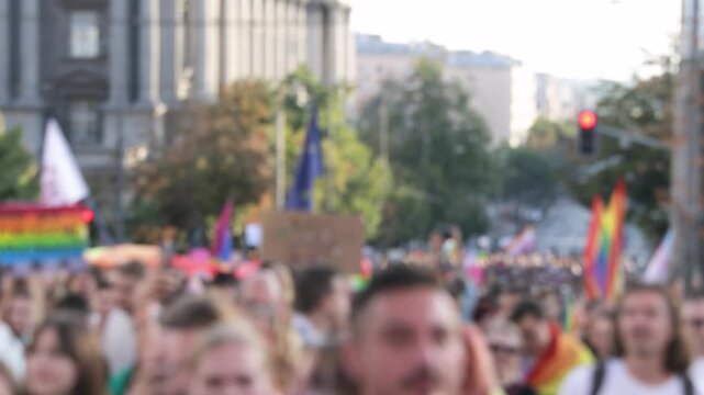 Blurred video of participants of LGBT parade or gay pride march