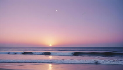 Fototapeta premium Crescent moon in a colorful sunset sky with pink and purple hues