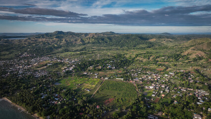 Aerial view of Nosy Be Island in Madagascar showcasing lush greenery and vibrant community life