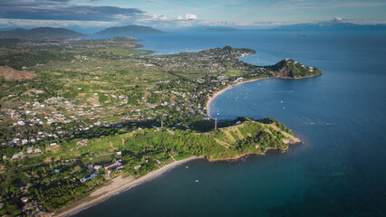 Aerial view of Nosy Be Island showcasing lush landscapes and coastlines of Madagascar during daylight hours