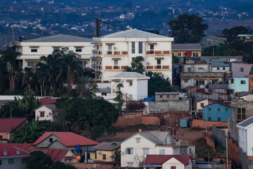 Authentic houses in Antananarivo showcasing diverse architecture against the city backdrop with vibrant colors and unique designs