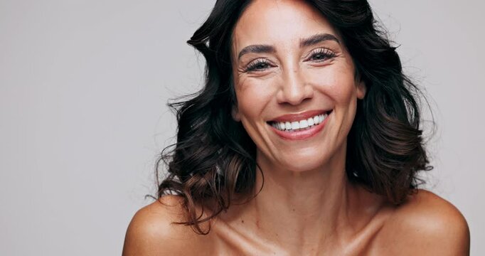 Beauty, face and funny with mature woman in studio isolated on white background for dermatology. Aesthetic, happy and skincare with portrait of model laughing at salon for antiaging transformation