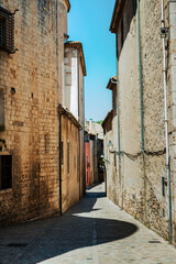 A quiet alleyway with old brick buildings